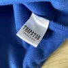 مسارات العرض غير الرسمي Trapstar Man مجموعة Chenille Decoded Actedwear Adtureditue Suitsuit مشرق مبهر الأزرق الأبيض تصميم الأزياء تصميم الحركة