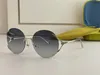 New fashion design sunglasses 0645S round rimless frame popular and simple style versatile outdoor uv400 protection glasses