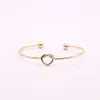 2022 new Fashion lovely knotted bangles iron alloy electroplated gold bangle for women wholesale top quality