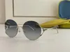 Nowe okulary przeciwsłoneczne projektowania mody 0645S okrągłe krawędzi popularne i proste styl wszechstronne okulary Uv400 Ochronia