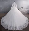 Africain Dubaï Élégant Manches Longues A-ligne Robes De Mariée Sheer Col Haut Appliques De Dentelle Perlée Vestios De Novia Robes De Mariée Avec Boutons Plus La Taille