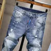 Jeans da uomo slim fit strappati elasticizzati Pantaloni con spruzzi di vernice alla moda Pantaloni in denim con foro invecchiato autunnale