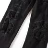 Jeans da uomo in denim nero con toppe screpolate elasticizzate