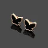 Charmsontwerper vierbladige bloem 18 karaat Gold Tiger Eye Stone VC Letters Mini Butterfly Stud Oorringen Mini gekleurde schelpen Luxe J4604070