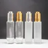 100 pièces 30 ml vide clair/verre givré huile essentielle bouteille de parfum avec pompe à pression flacon compte-gouttes