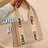 Tote 2024 One Handbag Hands Hands Tolevas Outlet Woody Designer Sac épaule Cloee Sacs Niche Design Portable Large Tote Tote Women's Ca Mrxt