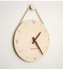 벽 시계 나무 슬링 창조적 인 시계 북유럽 및 홈 거실 장식 라우드 스피커 음소거 목가