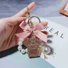 Anahtarlıklar Yaratıcı Moda Elmas Parfüm Şişesi Charm Keychain Korean Moda Yay Anahtarlık Üç Boyutlu Sevimli İnci Çantası Anahtarlık T220909