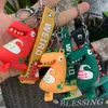 Keychains Hot Selling Fashion Cute Dinosaur Keychain Car Creative School Bag Pendant Soft Plastic Pvc Dinosaur Animal Toy Cute Girl Gift T220909