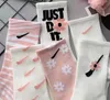 Chaussettes de sport chaussettes en fleurs de cerisier chaussettes de basket-ball hautes pour femmes Boom en coton