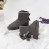 2023 Despesas uggitys austr￡lia botas de neve moda moda ugglie zable pendente arco projetar botas m￩dias marca de luxo wggs botas de l￣ Sapatos de inverno