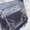 Le Cagole Borsa tote media da uomo in pelle di agnello Arena nera hardware argento invecchiato Borse a tracolla Designer Borsa a tracolla intrecciata in pelle Pochette rimovibile con zip