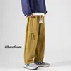 Pantaloni da uomo in cotone casual da uomo moda giallo nero tasca cargo giapponese streetwear pantaloni larghi dritti da uomo