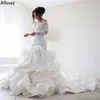 Rüschen Arabisch Wunderschöne Dubai Meerjungfrau Brautkleider für Braut mit langen Ärmeln schiere Nackenspitzenbrautkleider Kapelle Zug Slim und Flare Vestidos de Novia