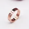 Mode poli designer amant bague logo imprimé femmes hommes couple en acier inoxydable anneaux 6mm 18k or argent rose dame fête mariage bijoux approvisionnement avec sac de velours