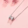 Collier en acier inoxydable femme léger luxe nouveau pendentif creux de printemps créatif avec des diamants luxueux des deux côtés à la mode 3982405