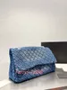 blue embroidered handbag