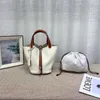 Venda bolsos de diseñador en el nuevo cubo de mano de moda para mujer de Togo de cuero superior nuevo 2023 a juego con el color