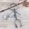 Keychains Fashionable New Keychains for Music Lovers Headphones Guitars Musical Punk Rock Heavy Metal Hipster Keyrings T220909