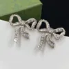 Nouveau style boucles d'oreilles mode populaire net rouge classique noeud papillon boucles d'oreilles femmes de luxe marque designer rétro motif mystérieux fête de mariage bijoux fins