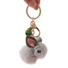 Cartoon Kunstfell Plüsch Kaninchen Keychain süße Wolle Filz Erdbeer Teddy Puppenform Schlüsselwomen Brieftasche Ornamente GIF