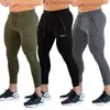 Survêtements pour hommes exercice pantalons de jogging serrés en cours d'exécution fitness musculation coton poches à glissière 221122