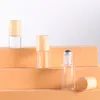 ボトルのガラスロール1ml 2ml 3ml 5ml金属ボールローラープラスチックウンデン穀物蓋付き香水エッセンシャルオイル