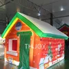 Envío Gratis, actividades al aire libre, casa de Navidad inflable personalizada, carpa inflable roja para fiesta de gruta de santa para decoración