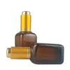 Quadratische Tropfflaschen aus bernsteinfarbenem Glas mit goldenem Druckknopf, Flasche für ätherisches Serum, 30 ml, 1 Unze, Kosmetikbehälter