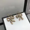 Charm Earrings designer for women new bow-knot pendant vintage understated fashion luxury brand designers 2022 home party high quality pop jewelry with box and stamp