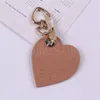 6 Cores de couro doce PU Heart Bowknot Cartoon Keychain for Women Triket Key Chains Ring Bag Saco de charme pendente de brinquedos infantis de961