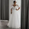 Une ligne de robes de mariée sexy hors de l'épaule V couche illusion appliques en dentelle Crystal perles