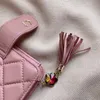 Franse luxe dames mini kleine portemonnees roze zwart lamsvacht gewatteerde designer portemonnee kwast hanger diamantpatroon kaarthouder244F