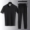 Roupas de ginástica 1 conjunto de roupas esportivas solta o gola da tripulação de pescoço intermediário da cintura para homens de escritório, as calças de meia-idade de meia-idade