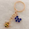 Nyckelringar 1 st söta kvinnor Hexagon Honeycomb Drip Oil Rhinestone Bee Keychain Par Insect Key Ring Bag Ornament Accessories