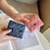 Borsa classica a tre pieghe Ringer di lusso Borsa corta da donna in pelle di pecora nuova moda multi-scomparto in pelle piccola clip profumata per il cambio