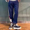 Designer di pantaloni da uomo Distinguiti dalla tendenza della versione di fascia alta del mercato GU Gujia Ricamo Nastro Coppia os Rilassato Casual Dritto HAXO