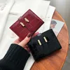 Fashion luxury patent leather short purse women's new Korean version of two fold crocodile wallet students everything folding card bag