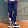 Designer di pantaloni da uomo Distinguiti dalla tendenza della versione di fascia alta del mercato GU Gujia Ricamo Nastro Coppia os Rilassato Casual Dritto HAXO