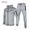 Pantaloni da tuta da uomo firmati da donna jogger Set di abbigliamento sportivo Stampa NK Giacca casual tecnica Pantaloni tuta mimetica jogger con cerniera