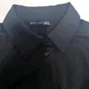 Chemises de chemisiers pour femmes banlieue basique Versatile la chemise noire féminine Fabric de longueur moyenne confortable