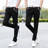 Мужские джинсы Оптовая мода весна весна лето. Случайная черная белая улица носить твяные брюки мужчины Понталлон Homme Skinny Pencil Pants 221128