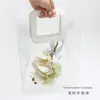 Presentförpackning transparent plasthandväska förpackning rött handtag blommor bukett inpackning väska födelsedag semester shopping ficka förvaring