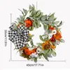 Decoratieve bloemen herfstkrans herfst esdoorn pompoen deur bladschepende oogst voor dankzegging