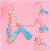 Nyckelringar Fashion AZ Letters Inledande nyckelkedja med Tassel Blue Stone Filling Plastic Keychain Söt handväska som hänger hänge