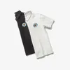 남성용 폴로 고품질의 솔리드 블랙 폴로 남성 2022 여름 패션 짧은 소매 태양 미소 자수 셔츠 m-5xl #d881