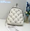 Bolsa de ombro de fábrica de fábrica por atacado 9 cores Personalidade de rua rebite mochila punk inverno espacial algodão de algodão leve confortável bolsa de moda