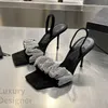 Frühe Frühlingsmodelle Kristall-High-Heels Ein Wort mit quadratischem Kopf Strass-Sandalen Europäischer und amerikanischer Wind Feiner Absatz Persönlichkeit Damenschuhe 0314221130