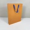 Sacchetti di carta regalo arancione borse da cofano per la panca della cintura di moda cinghia eaclana cratona di orecchini per le orecchie del braccialetto penente 9402396