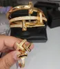braccialetto rigido gioielli designer gioielli diamante tridimensionale largo stretto amore orologi coppia moda oro partito liscio braccialetto da uomo anelli da uomo bracciali set